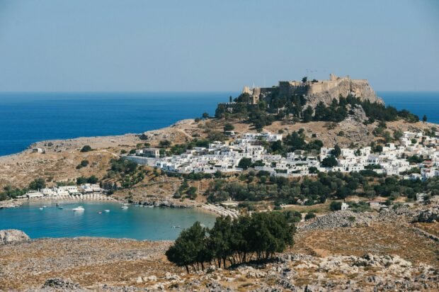View of the ancient Acropolis of Lindos and the white medieval village, a 20-minute drive from Almira Beach House in Kiotari.